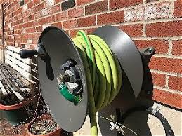 Watering your lawn and plants. What Is The Best Garden Hose Reel Outsidemodern