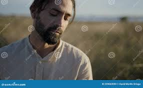 Bearded Spanish Man Playing Guitar and Singing by the River at Sunset
