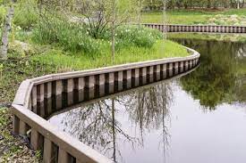 Check spelling or type a new query. Part Of Curved Retaining Wall Around Pond In Springtime Freestock Photos