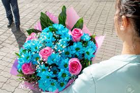 Check spelling or type a new query. Young Girl Holds Bouquet Of Blue And Rose Flowers Gift From Man For Birthday Woman S Day Or Valentine S Day View From The Back Stock Photo Picture And Royalty Free Image