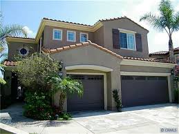 Black And White Spanish Style Home Exterior San Clemente French Gray Stucco Dark Gray Accents With Off White Exterior House Paint Color Combinations Exterior Paint Colors For House House Paint Exterior