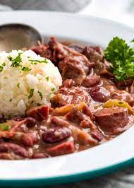 Add chopped seasoning blend and garlic to cooked sausage, along with 1/4 stick butter, and continue to cook until onions turn soft and clear. Southern Red Beans And Rice Kevin Is Cooking