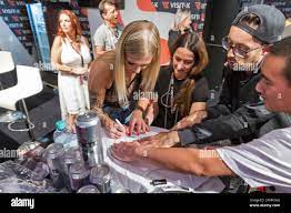 BERLIN, GERMANY - OCTOBER , 2019: Woman actress works at Visit-X online  porno video live sex cams booth during 23th Venus erotic and lifestyle  trade f Stock Photo - Alamy