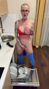 Bald Nerdy Hoe With Big Tits Peeing on the Dishes Video