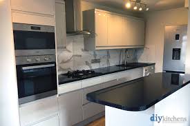 Dove Grey Gloss Kitchen Cabinets Handleless Cabinets Kitchen Cabinets Howdens