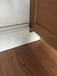 The old toe kick was made of particle board and absorbed water. Baseboard Meet Base Cabinet