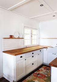 Butcher block countertops white cabinets. Love Subway Tile Butcher Block Countertops White Square Paneled Cabinetry Plate Rail No Upper Cabin Trendy Kitchen Tile Stylish Kitchen Kitchen Renovation