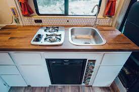 You could consider building a tent camper box, which can house a tent on top of it, and contains a kitchen or other amenities that you want to include. Diy Promaster Campervan Conversion Guide Part Ii