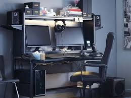A Dark Room With An Elaborate Computer Gaming Setup Ikea Computer Desk Office Computer Desk Desk