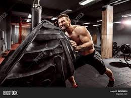Working out with tires is a part of strong man training and it has gained an important place among top 10 tire training moves for full body workout. Muscular Bearded Image Photo Free Trial Bigstock