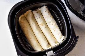 Spoon 1/4 cup beef mixture down the center of each tortilla. Air Fryer Chicken Taquitos Or Flautas Project Meal Plan