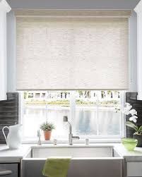Acheive a look of a roman shade at a fraction of the cost and effort. Roller Shades Roller Shades Living Room Window Treatments Living Room Roman Shades Living Room