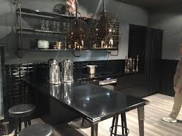 This kitchen boasts light wood cabinetry and a raised peninsula along with a small matching breakfast island situated in the center. Layouts That Reveal The Advantages Of Having A Kitchen Peninsula
