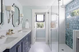White and blue textured wallpaper complements a bathroom boasting a navy blue washstand contrasted with a white quartz countertop and matching a navy blue parsons. Navy Blue Dual Bath Vanity Cabinets Design Ideas
