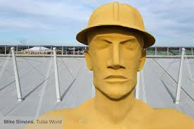 A few months ago we needed to run a file photo of the Golden Driller. I  realized something. We photograph the big guy a lot when they are hanging  something goofy on