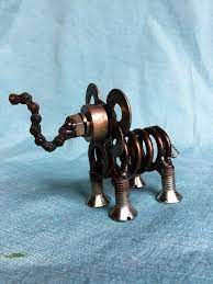 A Quirky Little Elephant Sculpture Welded From Various Auto Parts This One Of A Kind Piece Is Sprayed Scrap Metal Art Elephant Sculpture Metal Art Projects