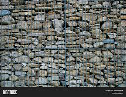 There is no need to build a foundation below the frost line because the loose stones can shift slightly to accommodate frost heave. Stone Wall Grindstone Image Photo Free Trial Bigstock