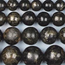 It is a grounding stone that combines pyrite (also known as fools gold) and magnetite (also known as lodestone). Healers Gold Single Round Beads