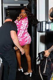 Megan Thee Stallion shows some legs in a pink mini dress as she returns to  her