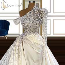 Long sleeve dresses are ideal for cold season weddings because you feel cozier in them plus such a dress is timeless, and you can also go for a church ceremony in a long sleeve dress. One Shoulder Long Sleeve Wedding Dresses Luxury Pearls High Split Mermaid Satin Bridal Gowns Aliexpress