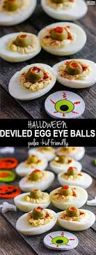 They'll make your party guests giggle, and they taste delicious too! Deviled Egg Eyeballs And Spooky Paleo Halloween Snacks Paleo Deviled Eggs Halloween Deviled Eggs Spooky Snacks