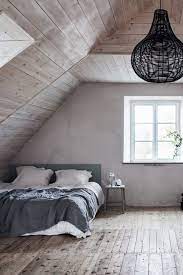 A simple bedroom with wooden panels on one side of the wall. 16 Wood Wall Paneling Makeover Ideas How To Update And Paint Wood Paneling