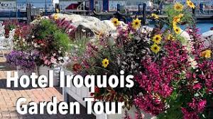Awarded a perfect 100 location points by conde nast traveler magazine for it's beautiful waterfront setting, hotel iroquois has 45 guest rooms and suites, classically sophisticated and comfortable with fine furnishings and vibrant colors. A Walk Through The The Gardens Of Hotel Iroquois Mackinac Island Youtube