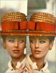 June Duncan wears a dark, narrow dress, in black dupion, over one hip a  swag of scrawl-printed emerald crêpe by Spectator, hat by Erik, classic  patent pumps by Fanchon, photo by Keith