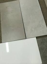 Many types of tile flooring happen to be used. Bathroom Wall And Floor Tiles 300 X 600 Gloss White On The Walls 300 X 300 Mottled Grey Lightest One Laundry In Bathroom Wall And Floor Tiles Bathroom Wall