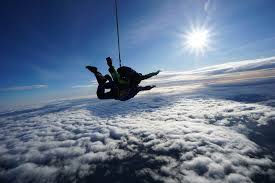 Four skydiver are training in the sky. Why Should You Skydive 5 Reasons That Will Make You Want To Leap Out That Plane Skydive Langar