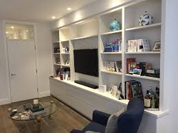 Black, white, light & dark wood. Media Unit For Client In Surrey The Bookcase Co