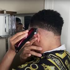 Taper fade haircut with side part. A Barber S Tips On Doing A Men S Fade Haircut Popsugar Beauty
