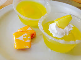 By The Jello Shot Queen Yours Truely Lemon Starburst Jello Shots With A Vodka Sugar Dipped Rim Dollop Of W Jello Shot Recipes Lemon Jello Shots Lemon Jello