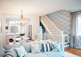 This Coastal Living Room With Sky Blue Interiors And Elegant Creamy Walls And Staircase Show Us Ho Timeless Living Room Living Room Reveal Family Living Rooms