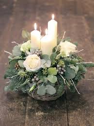 50 The Best Winter Table Decorations You Need To Try Sweetyhomee Christmas Floral Arrangements Christmas Flower Arrangements Candle Flower Arrangements