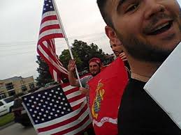 Man Who Held US Flag for 14 Hours in Garland Returns With an Even Bigger  Flag, Urges Solidarity