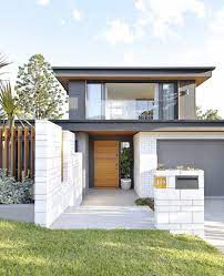 Inside Out On Instagram After Deciding To Knock Down And Rebuild A Brisbane Couple Have Created Gray House Exterior Palm Springs Style Exterior House Colors