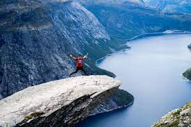 It is an incredibly scenic hike, ending at the troll's tongue, a thin sliver of rock. Trolltunga Hike In Norway From Skjeggedal Odda Feralescape