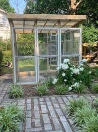 Recycled Windows Make Creative Green House Greenhouse Diy Faux Rocks Easy Diy Decor