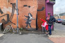 He produces pieces of work which pop up in public places, such as on the walls of buildings. People React With Joy As Banksy Confirmed As Artist Behind Nottingham Artwork Nottinghamshire Live