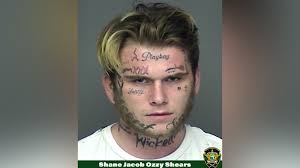 Florida man with 'playboy' face tattoo arrested for robbery