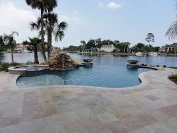 You can install a base of compacted gravel, then 1 of travertine is a huge upgrade. Ivory Swirl Travertine Pavers Tropical Patio Miami By Travertine Mart Houzz