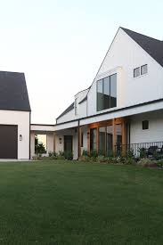 White modern farmhouse with black windows. Cc And Mike 2020 Project Recap And 2021 Preview White Modern Farmhouse Exterior With Black Aluminum Windows And Cedar Accents Lake House Cc Mike