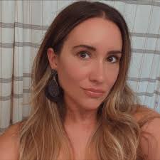 What can help alleviate elbow pain for a softball player?