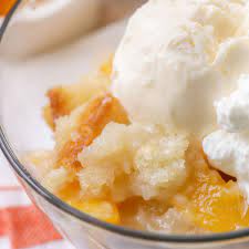 Peaches and sugar in baking dish. Easy Peach Cobbler Video Just 5 Minutes To Prep Lil Luna