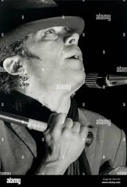 Ian Dury British singer and songwriter at scene during concert Stock Photo 