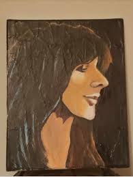 Can you guess who the singer is in the one-year-old's birthday portrait?