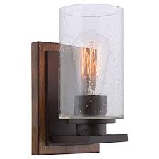 Oat manmade linen shade with white manmade silk inside.shade: Kira Home Sedona 9 Modern Rustic Wall Sconce Seeded Glass Cylinder Shade Oil Rubbed Bronze Wood Style Walnut Buy Online In Bahrain At Bahrain Desertcart Com Productid 92756953