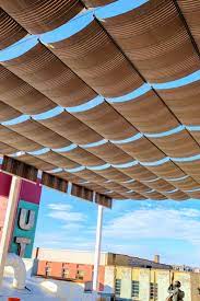 Balcony With Beautiful Fabric Wave Shades On Retractable Cables Patio Shade Covers Patio Shade Shade Cover
