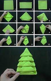 green napkin in the shape of a christmas tree folding diy tutorial step by step paper napkin foldin pliage serviette noel pliage serviette serviette papier